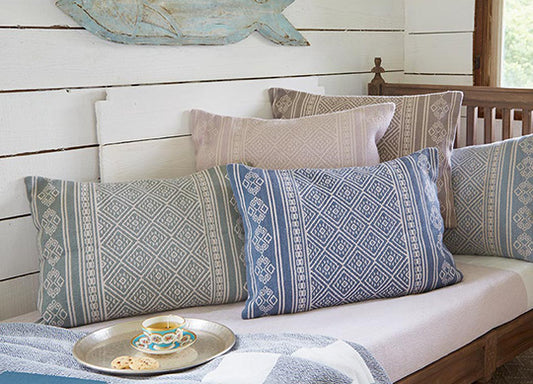 boho cushions on day bed with tea