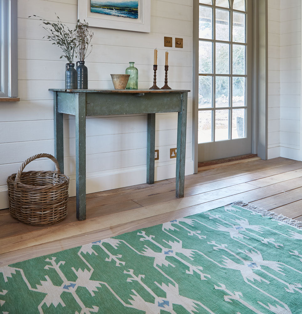 anatolia green rug in the hallway