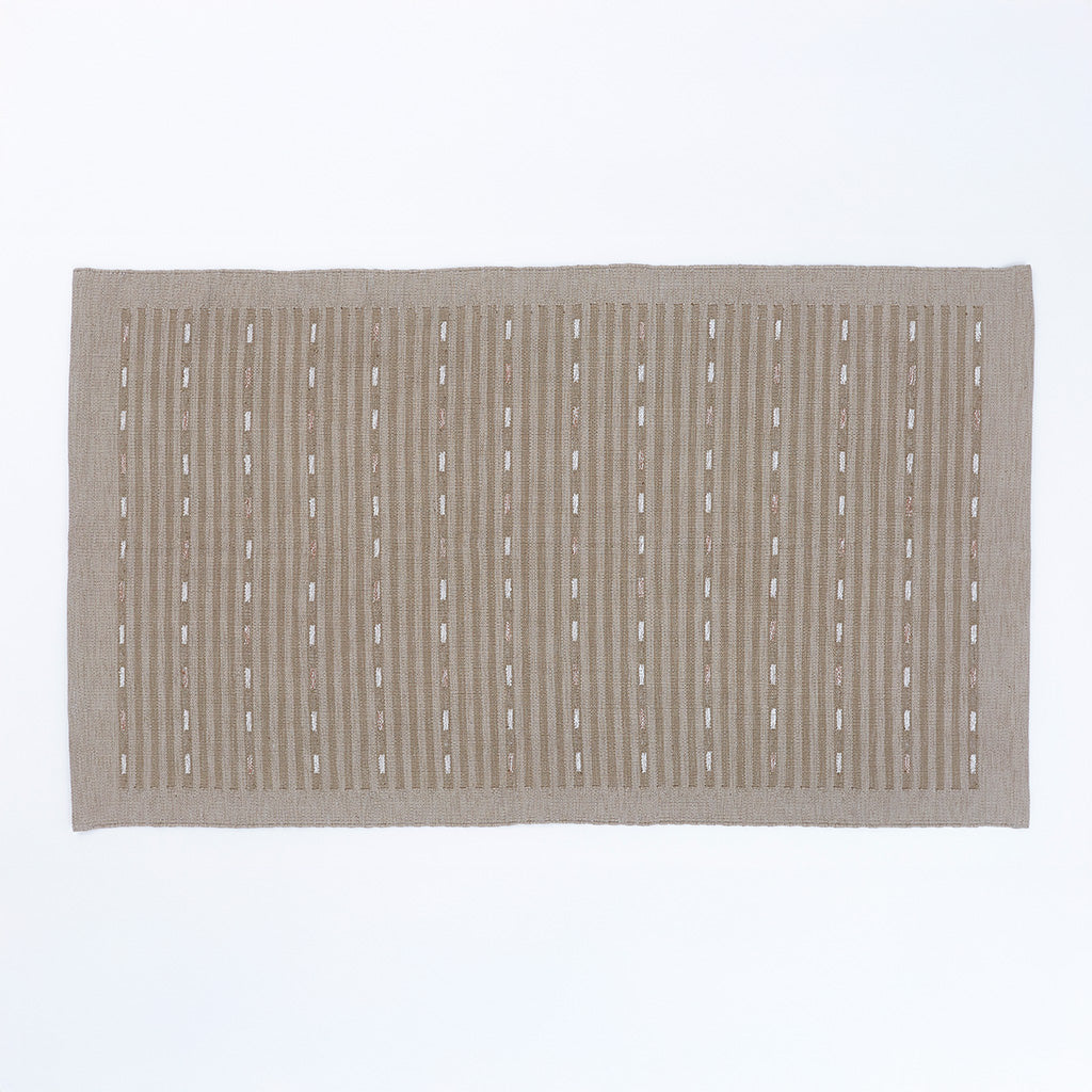 Beige rug with a striped pattern on a white background