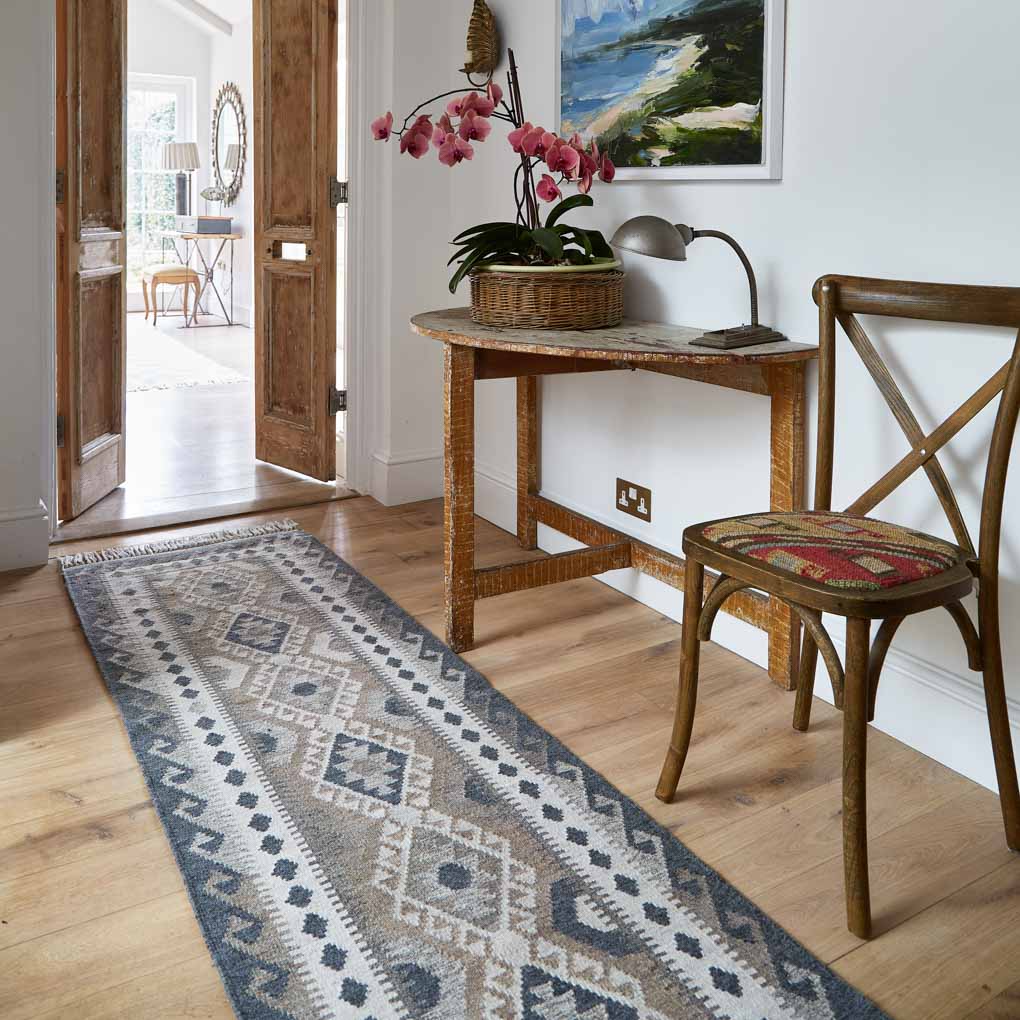 monochrome geometric kilim rug in a hallway