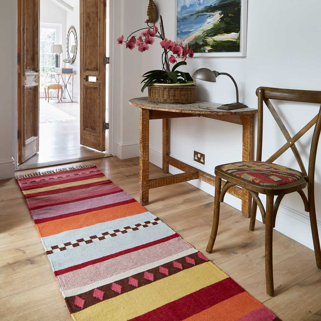 Stripey runner rug in the hallway.