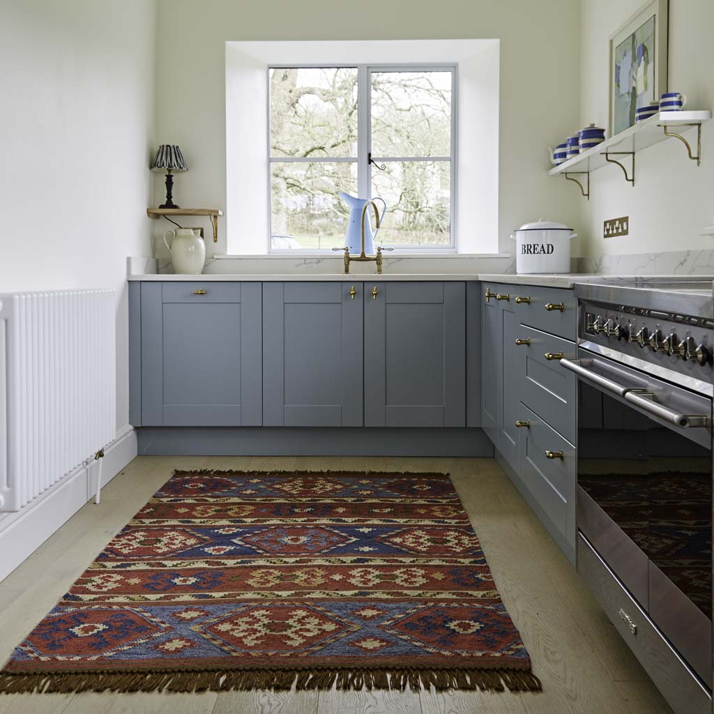 Nomad taurus rug in a blue kitchen