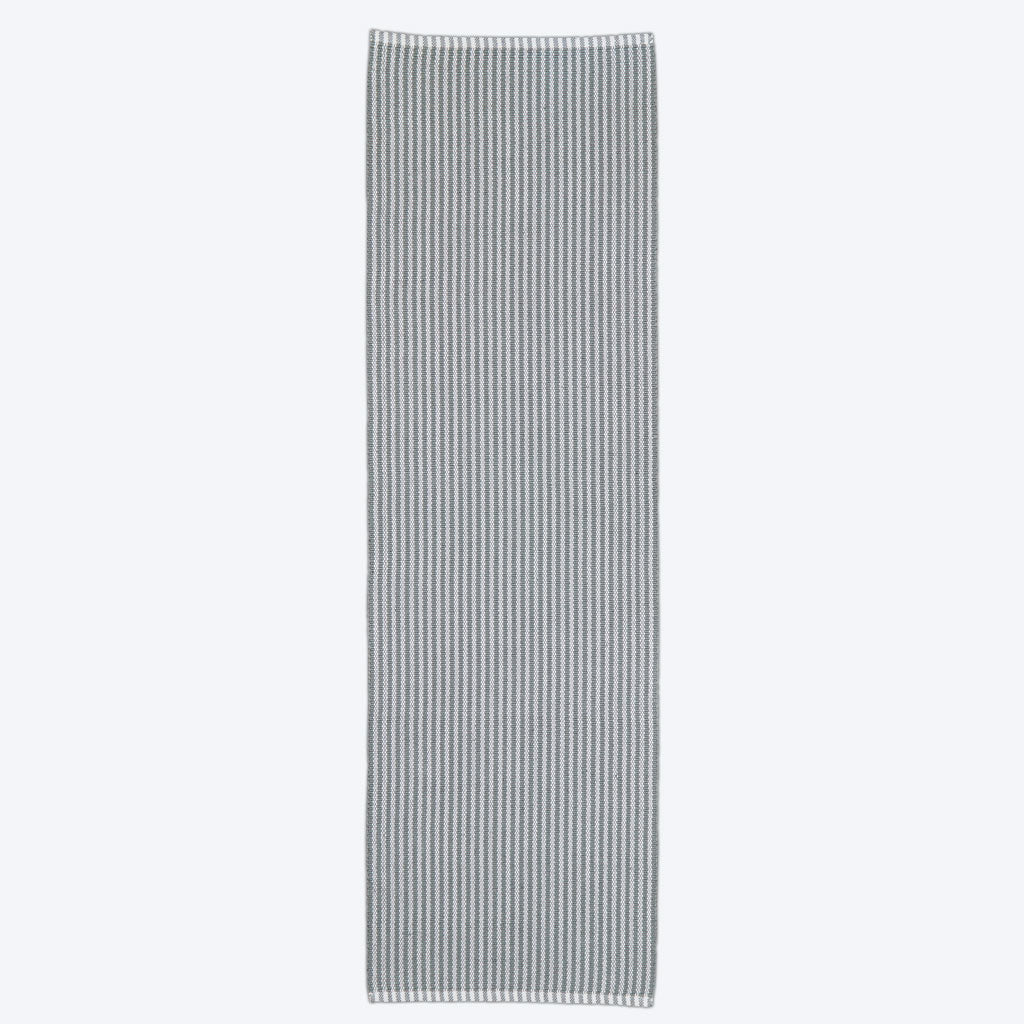 A dove grey striped rug,