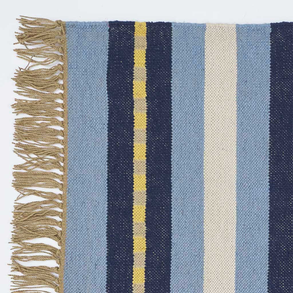 Detail corner shot of a blue striped rug