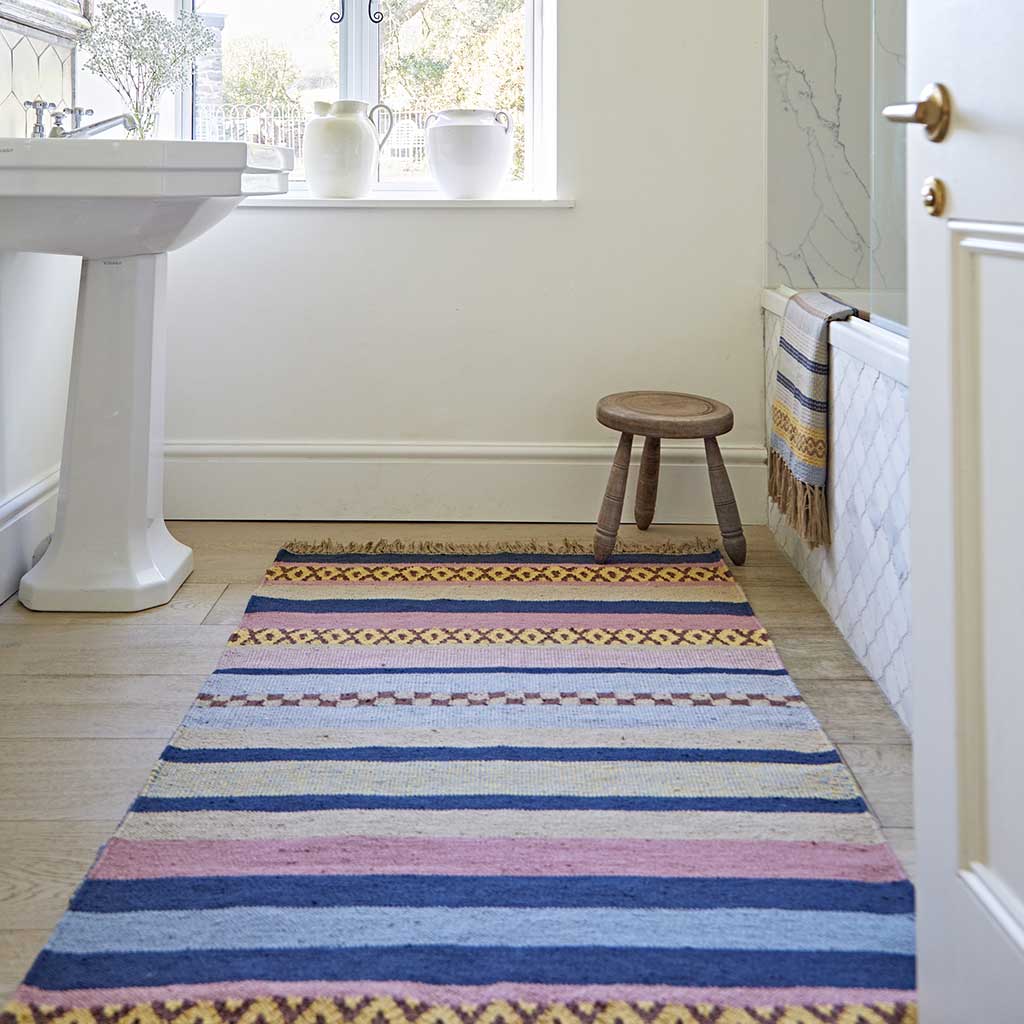 striped rug in bathroom
