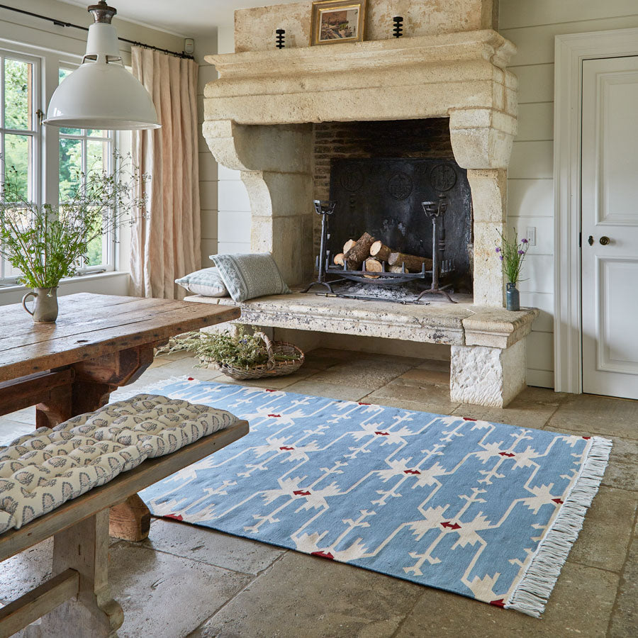 anatolia sky blue rug in the kitchen next to the fireplace 