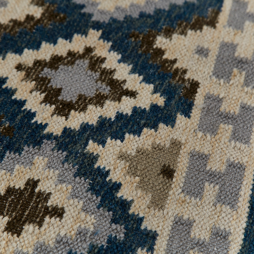 blue geometric patterned rug