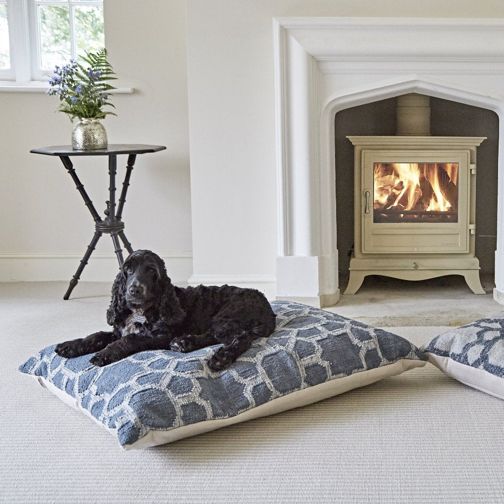 Kasbah Ink Floor Cushion with dogs by the fire