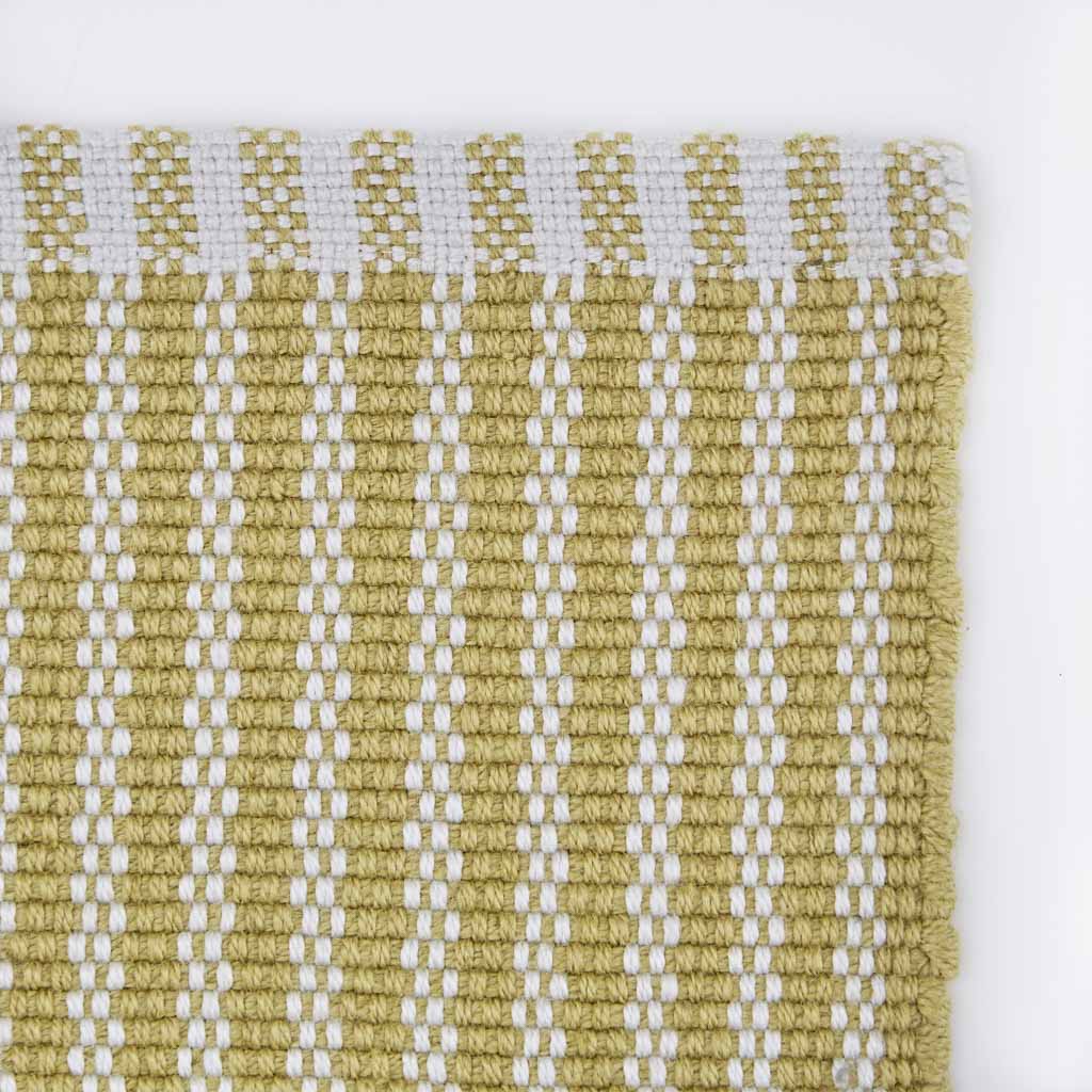 yellow striped rug corner 