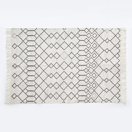 white geometric rug with diamond pattern